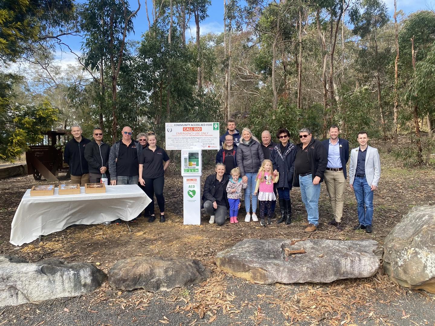 Community members celebrating the installation of AED 100